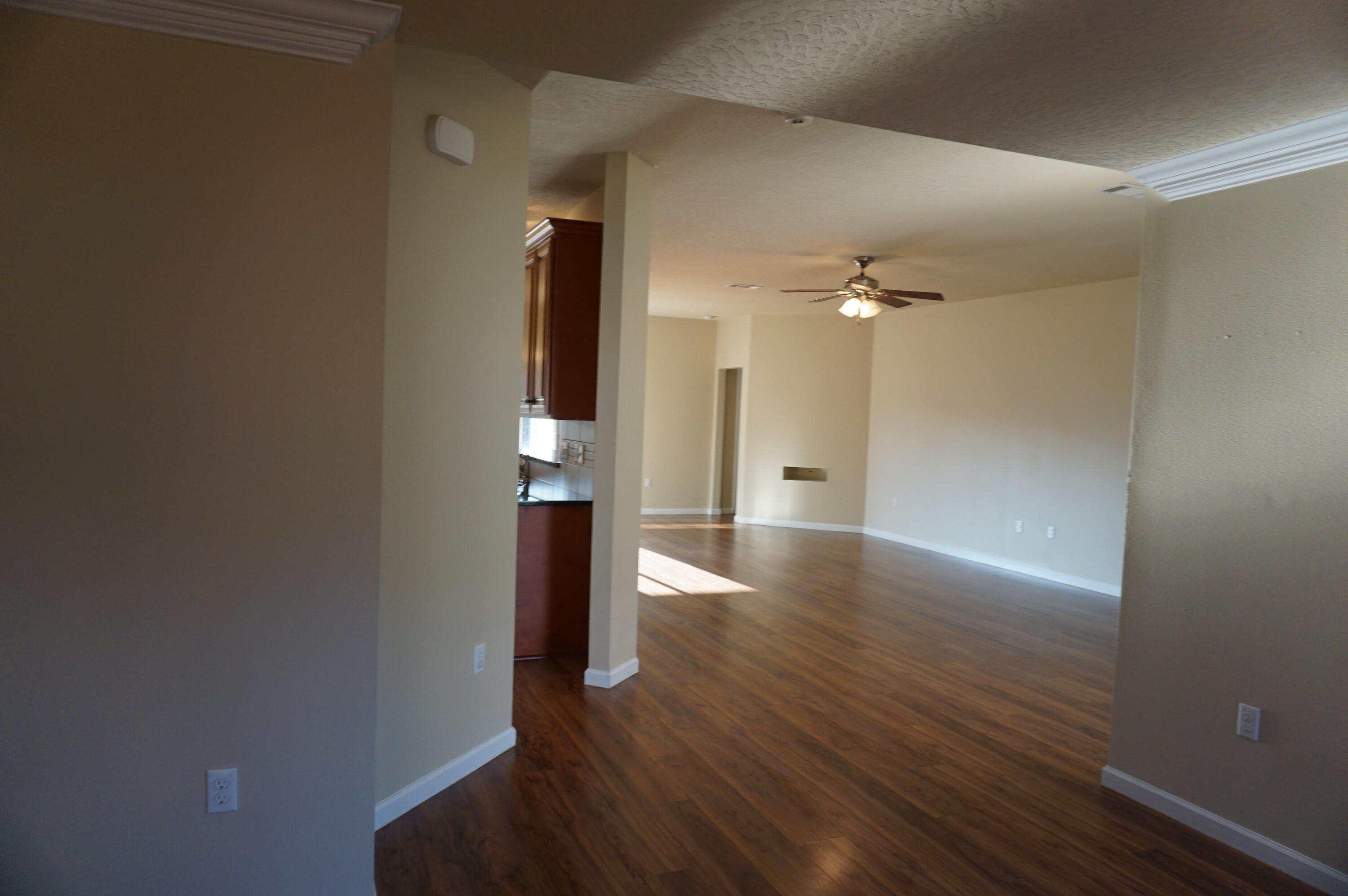 5263 Moore Loop Crestview, FL 32536 - Photo 7 of 37 a view of a hallway with wooden floor