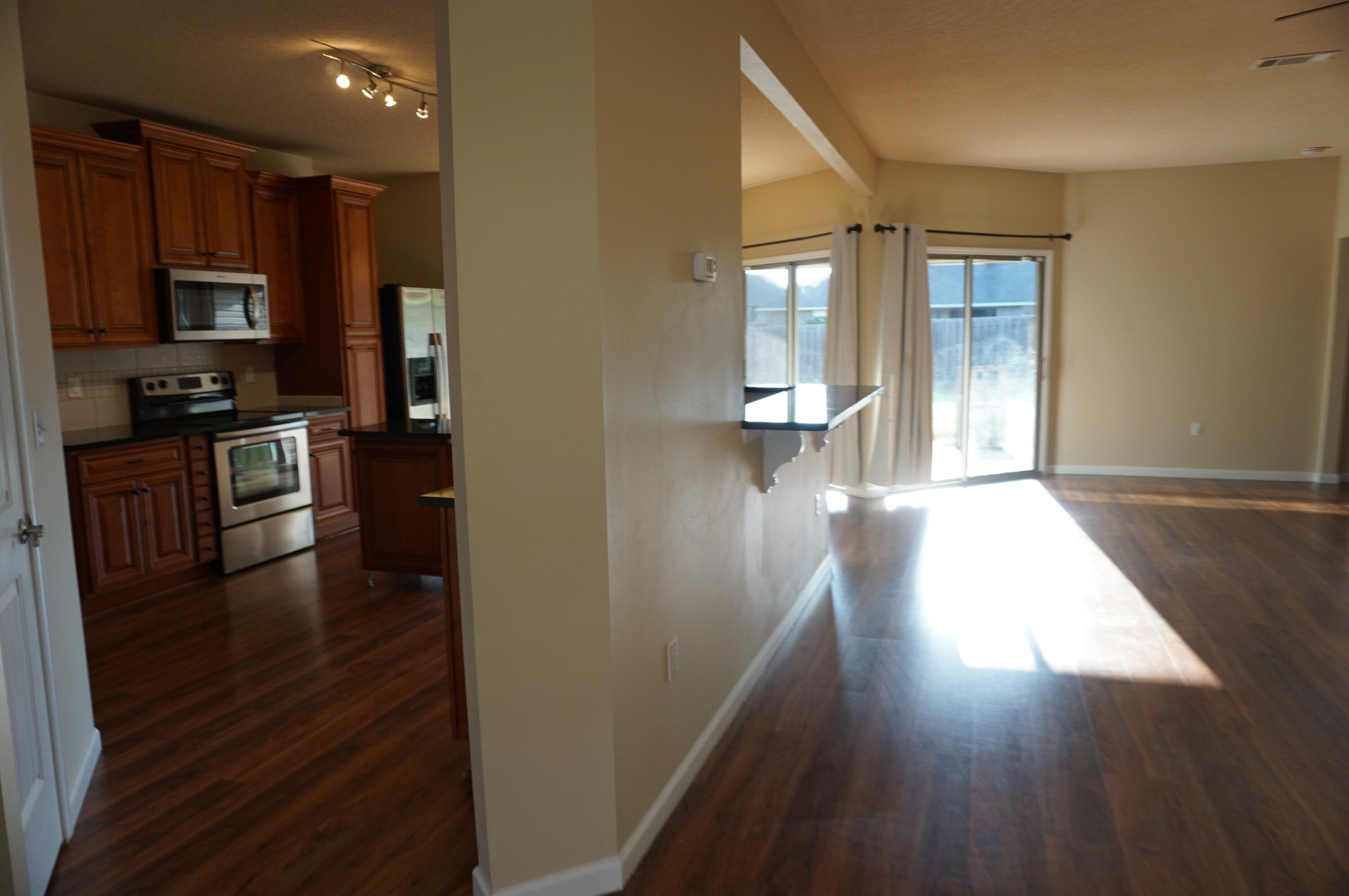 5263 Moore Loop Crestview, FL 32536 - Photo 8 of 37 a view of a kitchen from the hallway