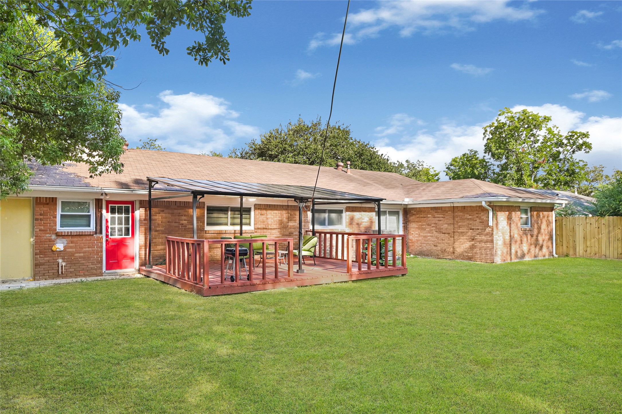 1806 Clayton Drive Baytown, TX 77520 - Photo 1 of 40 a view of a house with a yard and sitting area
