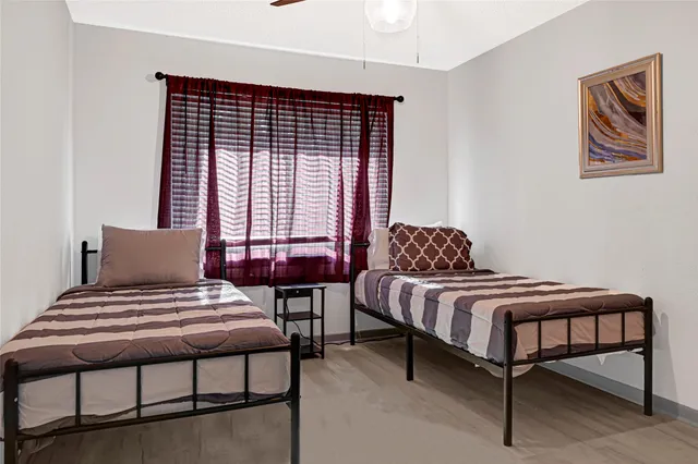 a bedroom with a bed and window