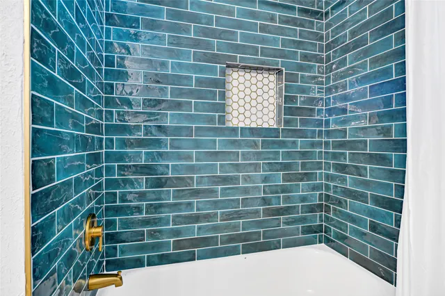 a bathroom with a granite countertop toilet a sink and a mirror