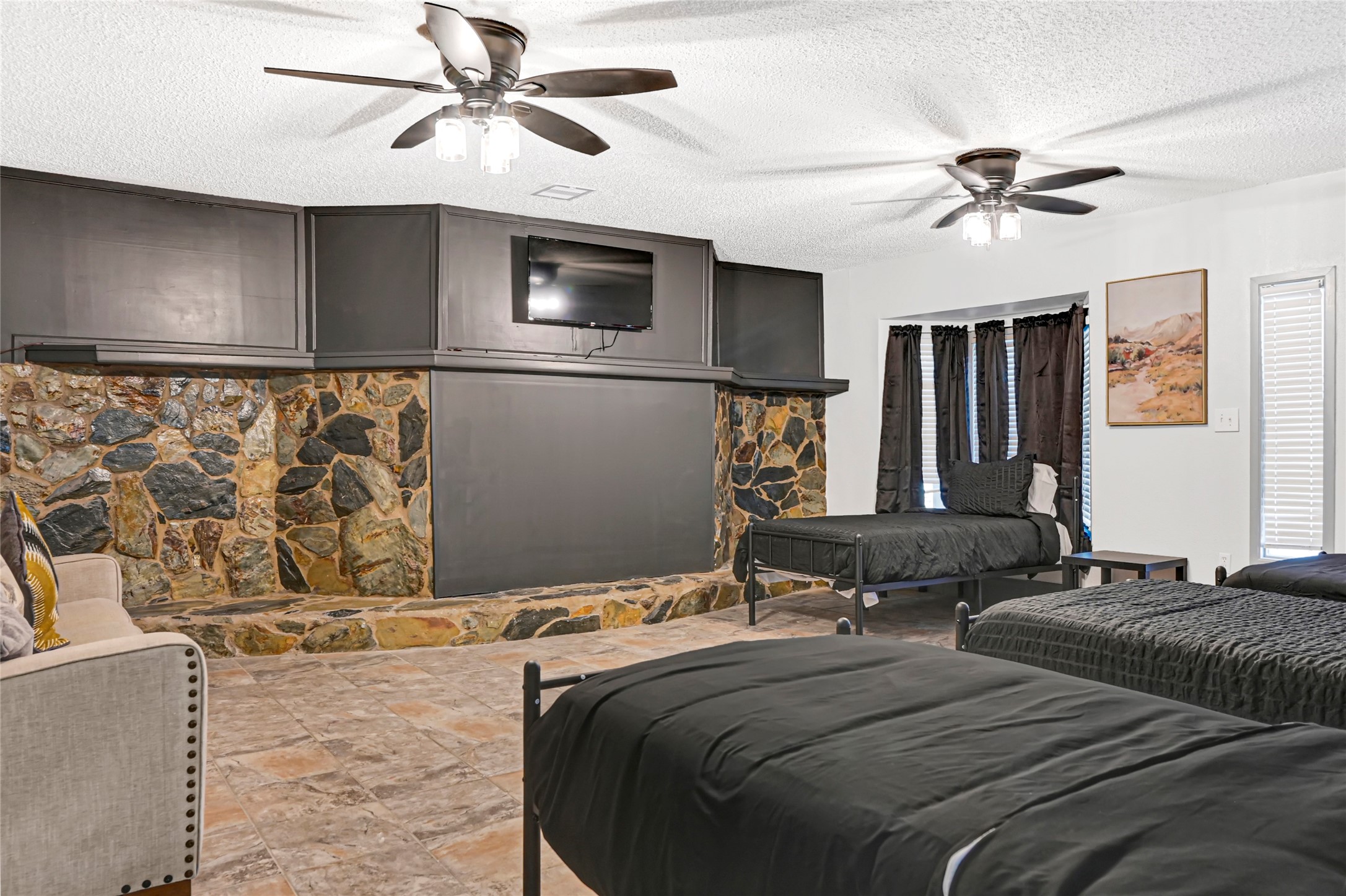 1806 Clayton Drive Baytown, TX 77520 - Photo 16 of 40 a bedroom with a large bed and a chandelier