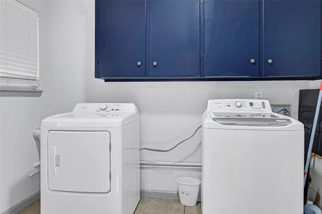 a kitchen with a refrigerator and cabinets