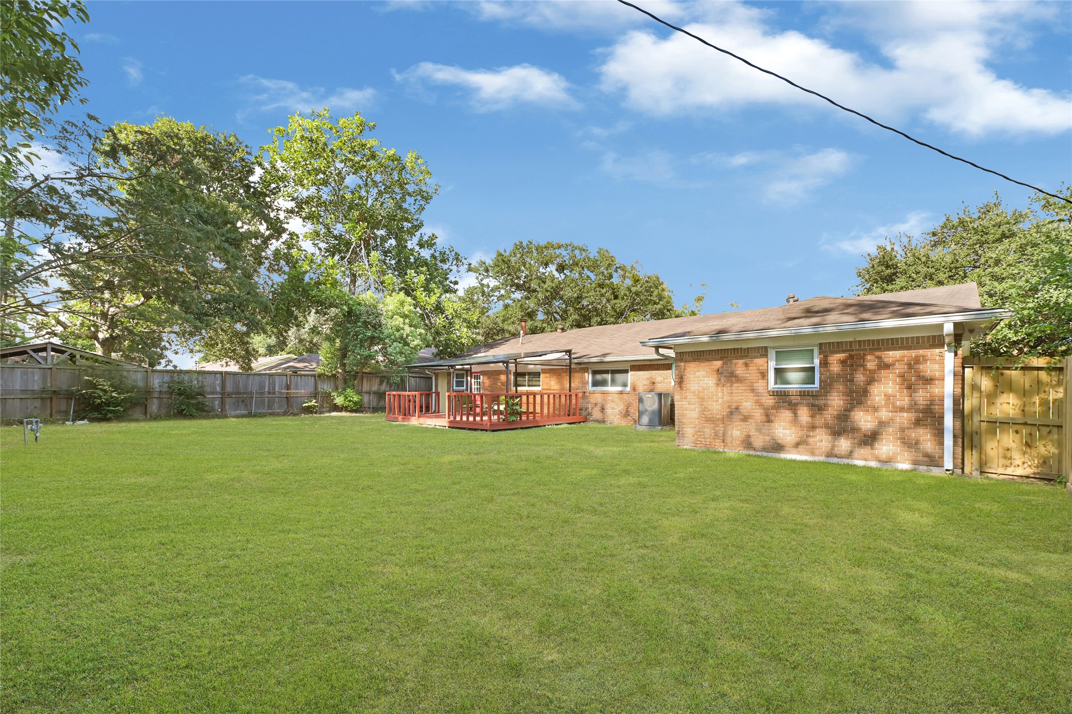 1806 Clayton Drive Baytown, TX 77520 - Photo 2 of 40 a view of a yard in front of a house