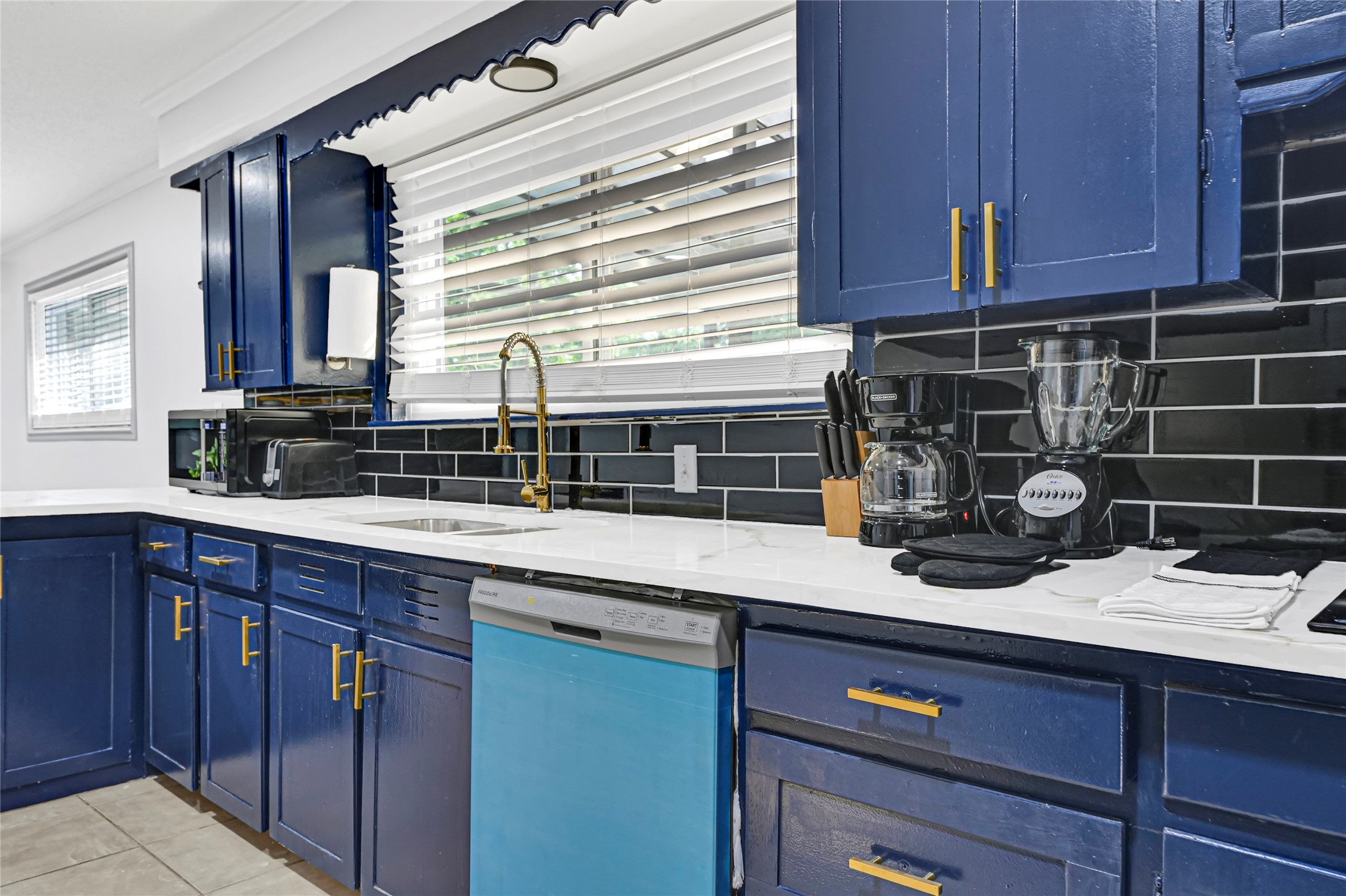 1806 Clayton Drive Baytown, TX 77520 - Photo 24 of 40 a kitchen with a sink and cabinets