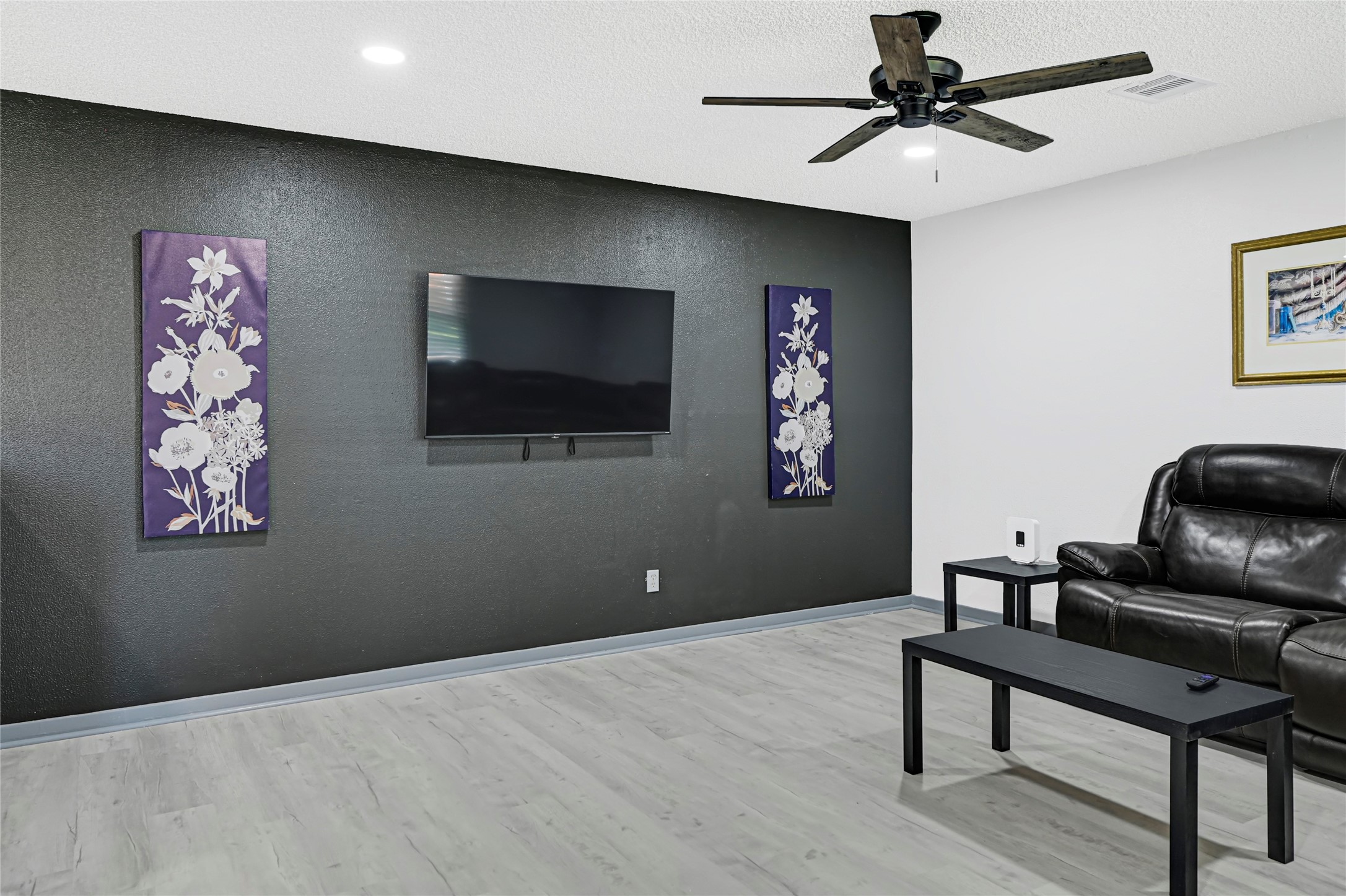 1806 Clayton Drive Baytown, TX 77520 - Photo 27 of 40 a living room with furniture and a flat screen tv