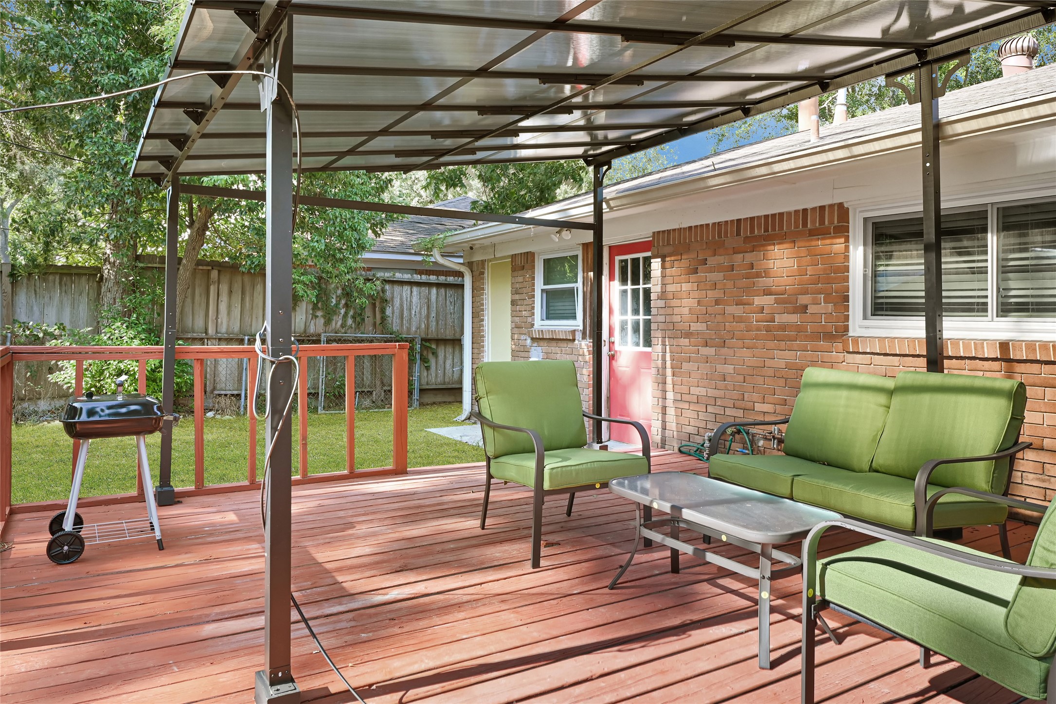 1806 Clayton Drive Baytown, TX 77520 - Photo 3 of 40 a view of a chair and tables in patio with wooden floor
