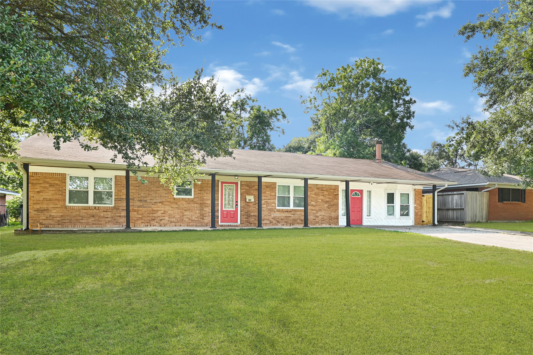 1806 Clayton Drive Baytown, TX 77520 - Photo 31 of 40 a big house with a big yard and large trees