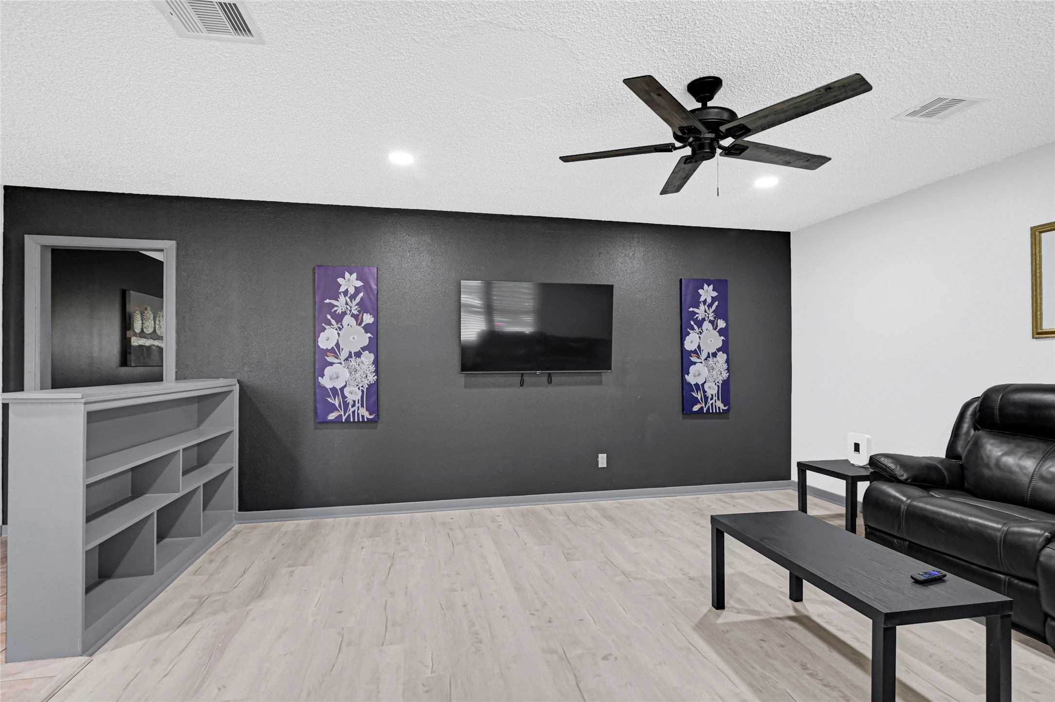 1806 Clayton Drive Baytown, TX 77520 - Photo 32 of 40 a living room with furniture and a flat screen tv