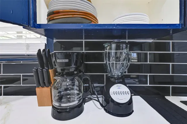 a bedroom with furniture and a chair