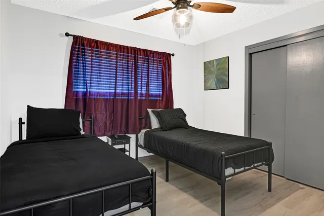 a bedroom with furniture and a window