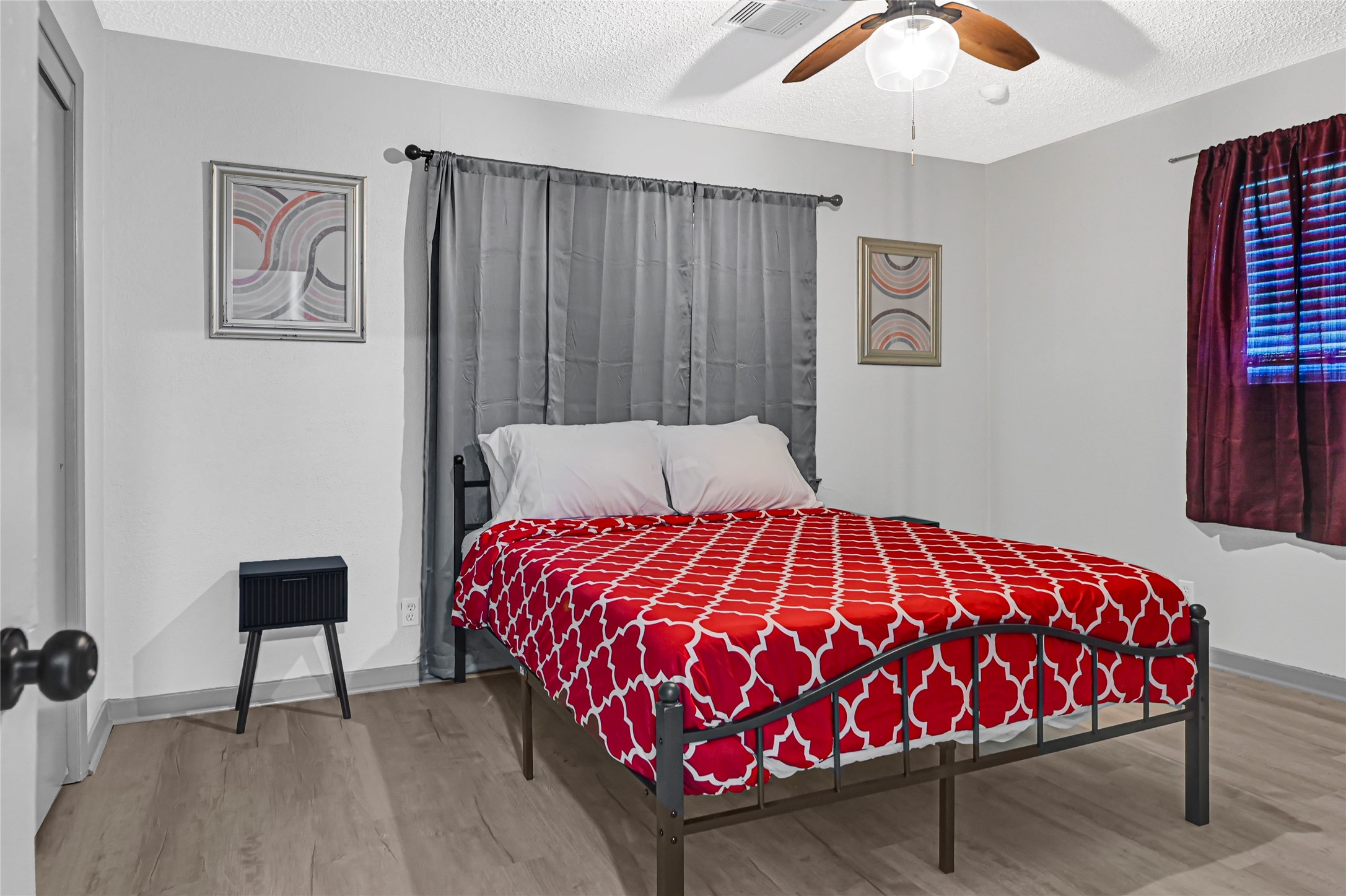 1806 Clayton Drive Baytown, TX 77520 - Photo 10 of 40 a bedroom with a bed and painting on the wall