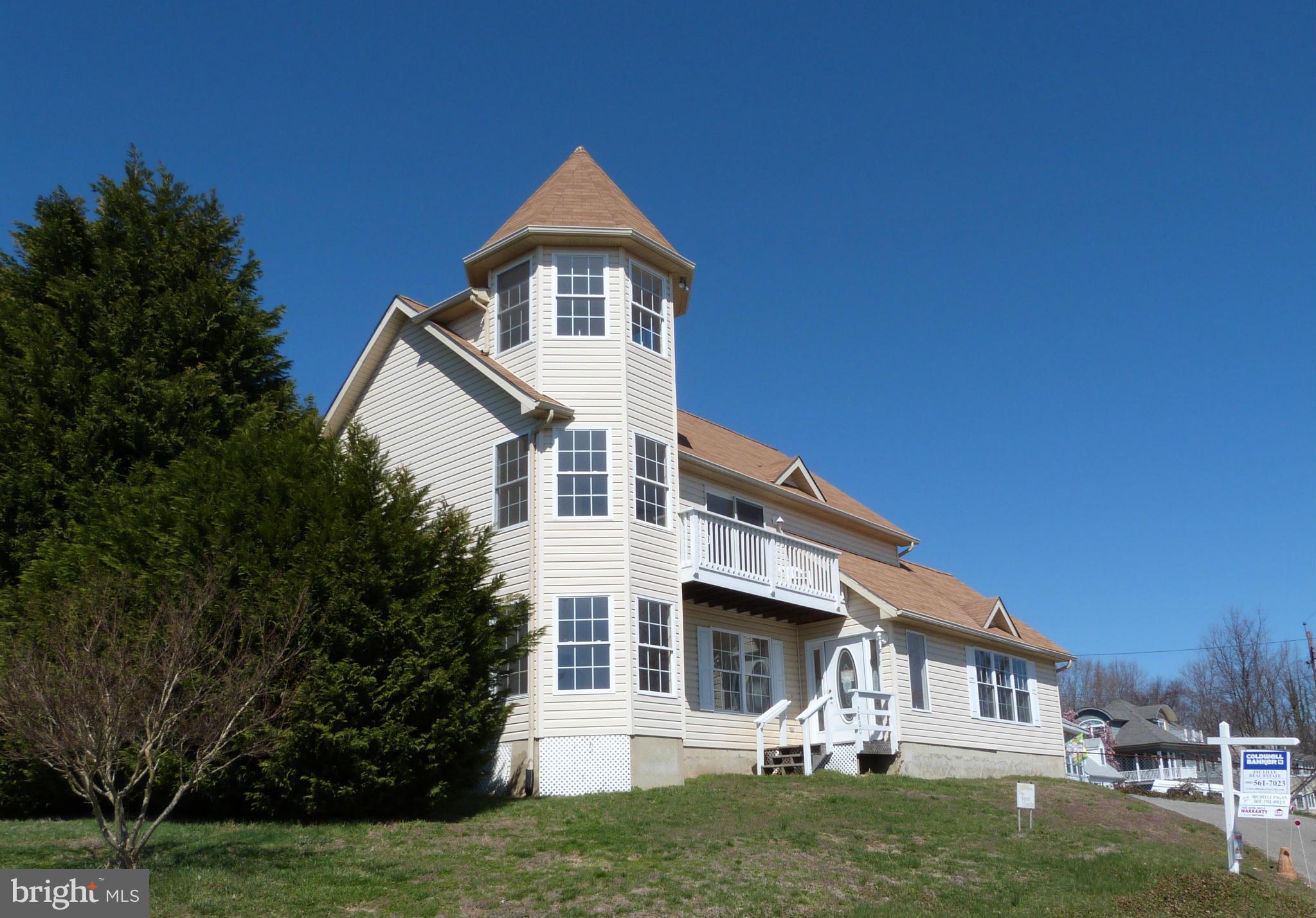 2800 Ridge Road Huntingtown, MD 20639 - Photo 1 of 17 a front view of a house with a yard