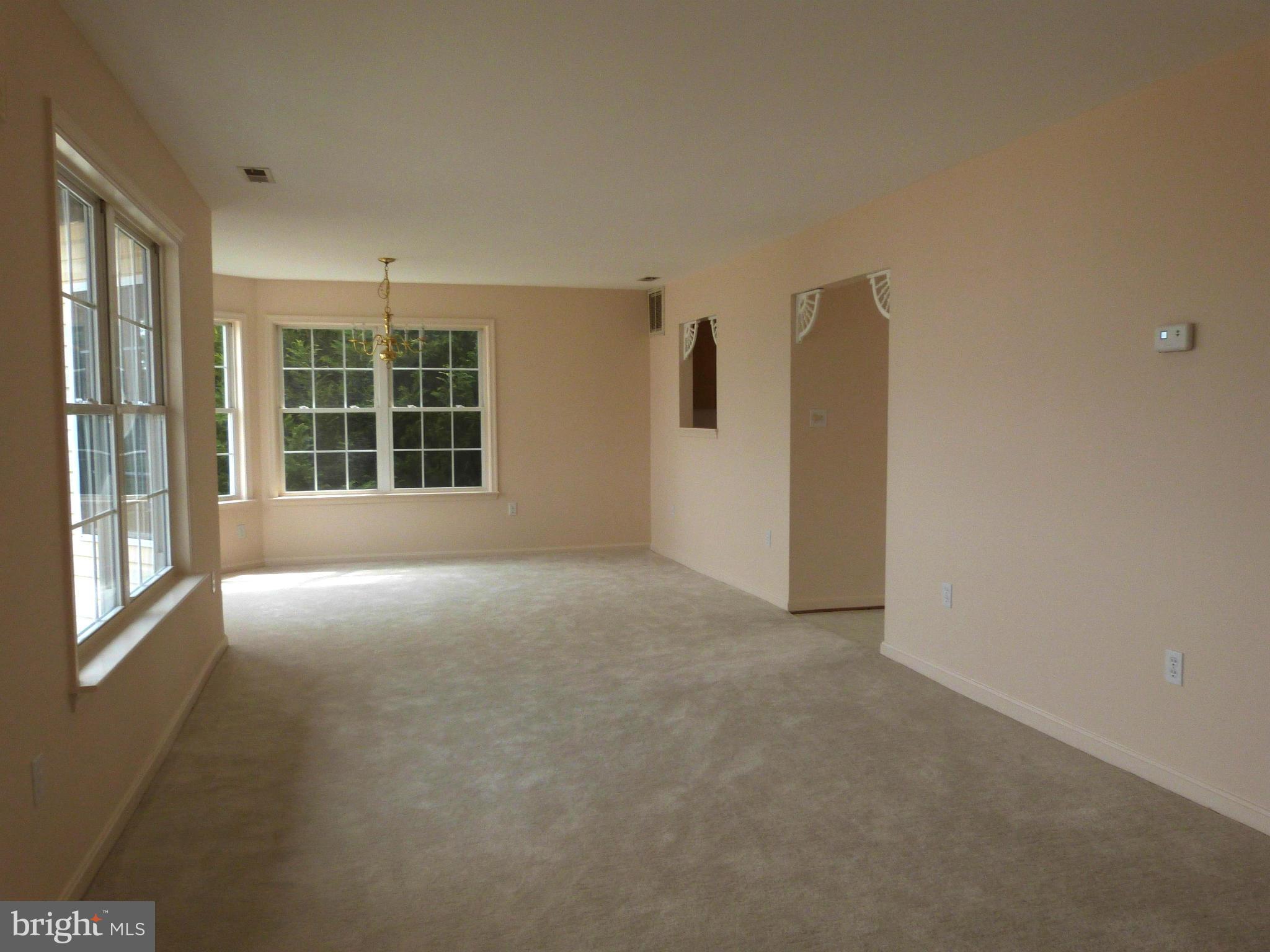 2800 Ridge Road Huntingtown, MD 20639 - Photo 5 of 17 a view of an empty room with a window