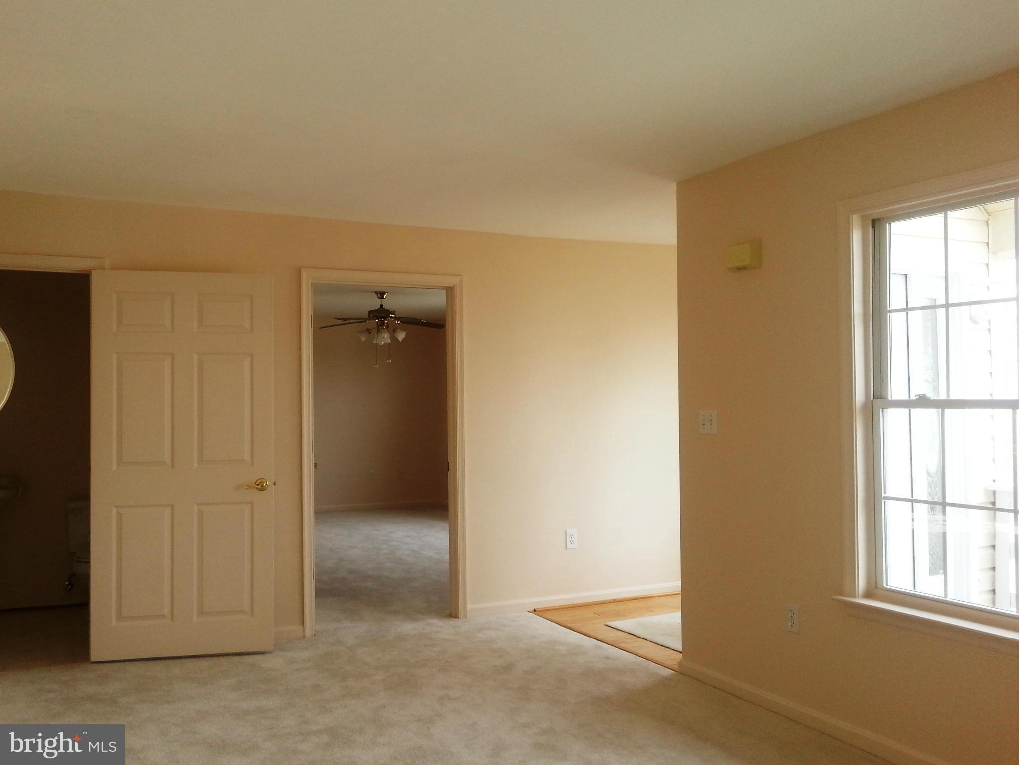 2800 Ridge Road Huntingtown, MD 20639 - Photo 7 of 17 an empty room with windows