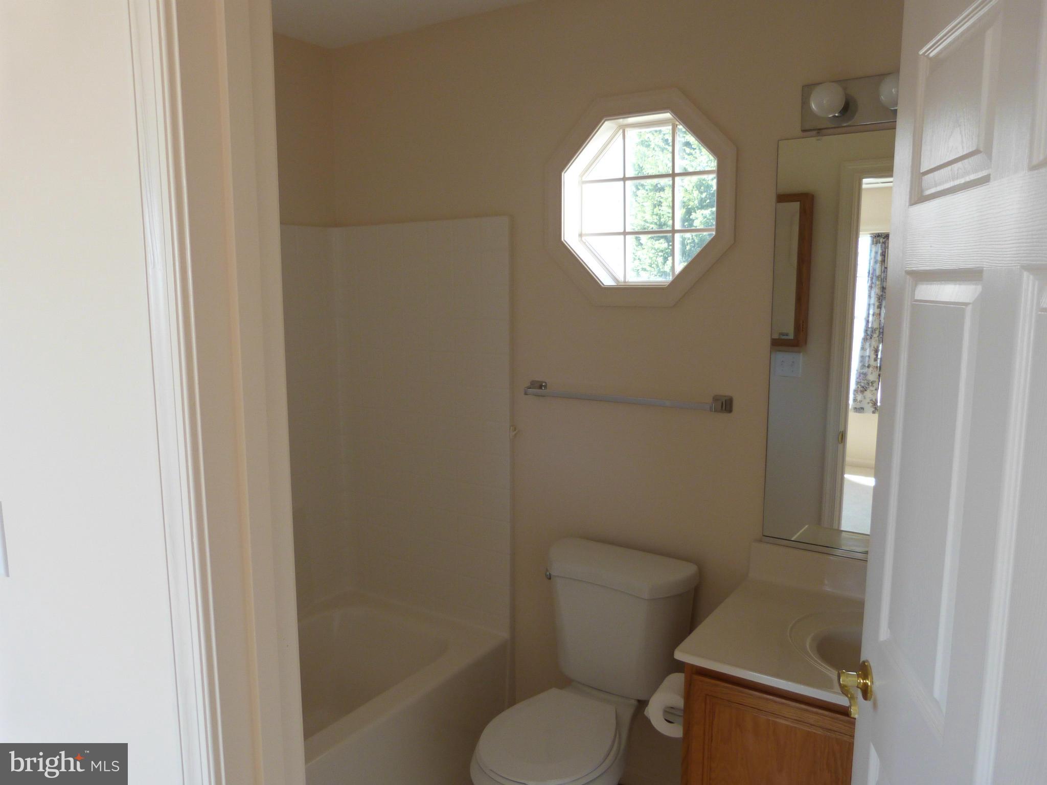 2800 Ridge Road Huntingtown, MD 20639 - Photo 8 of 17 a bathroom with a toilet and a shower