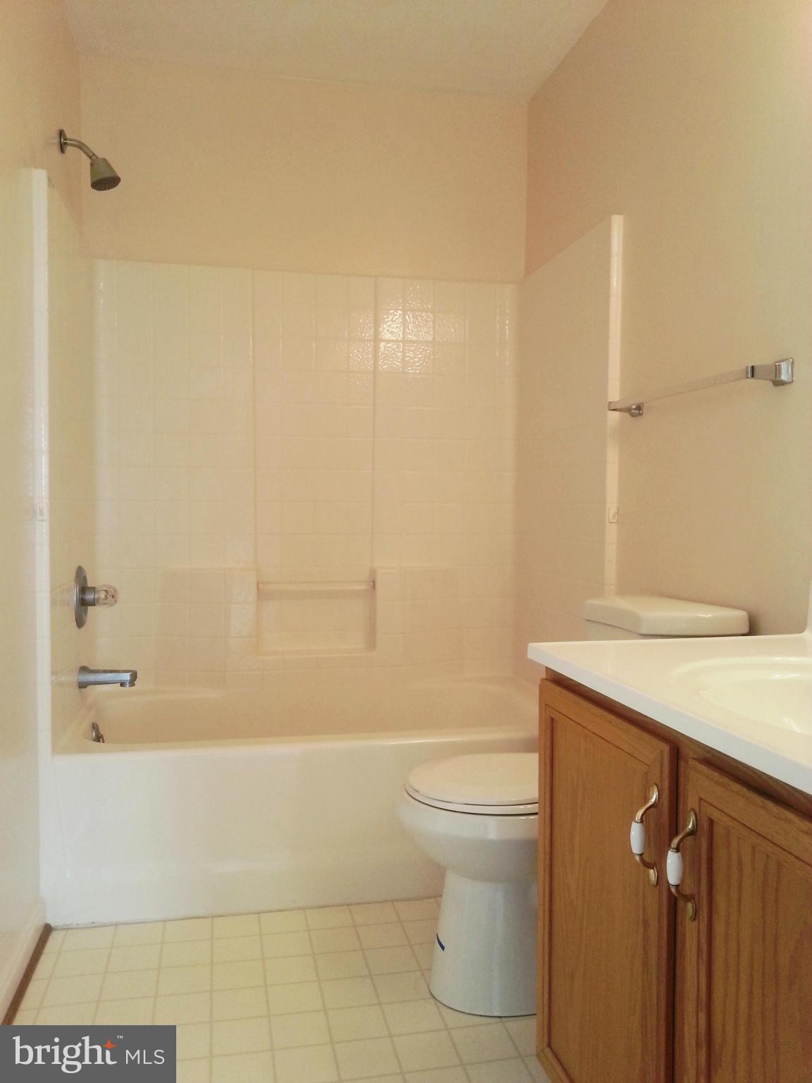 2800 Ridge Road Huntingtown, MD 20639 - Photo 10 of 17 a bathroom with a shower a toilet and a sink