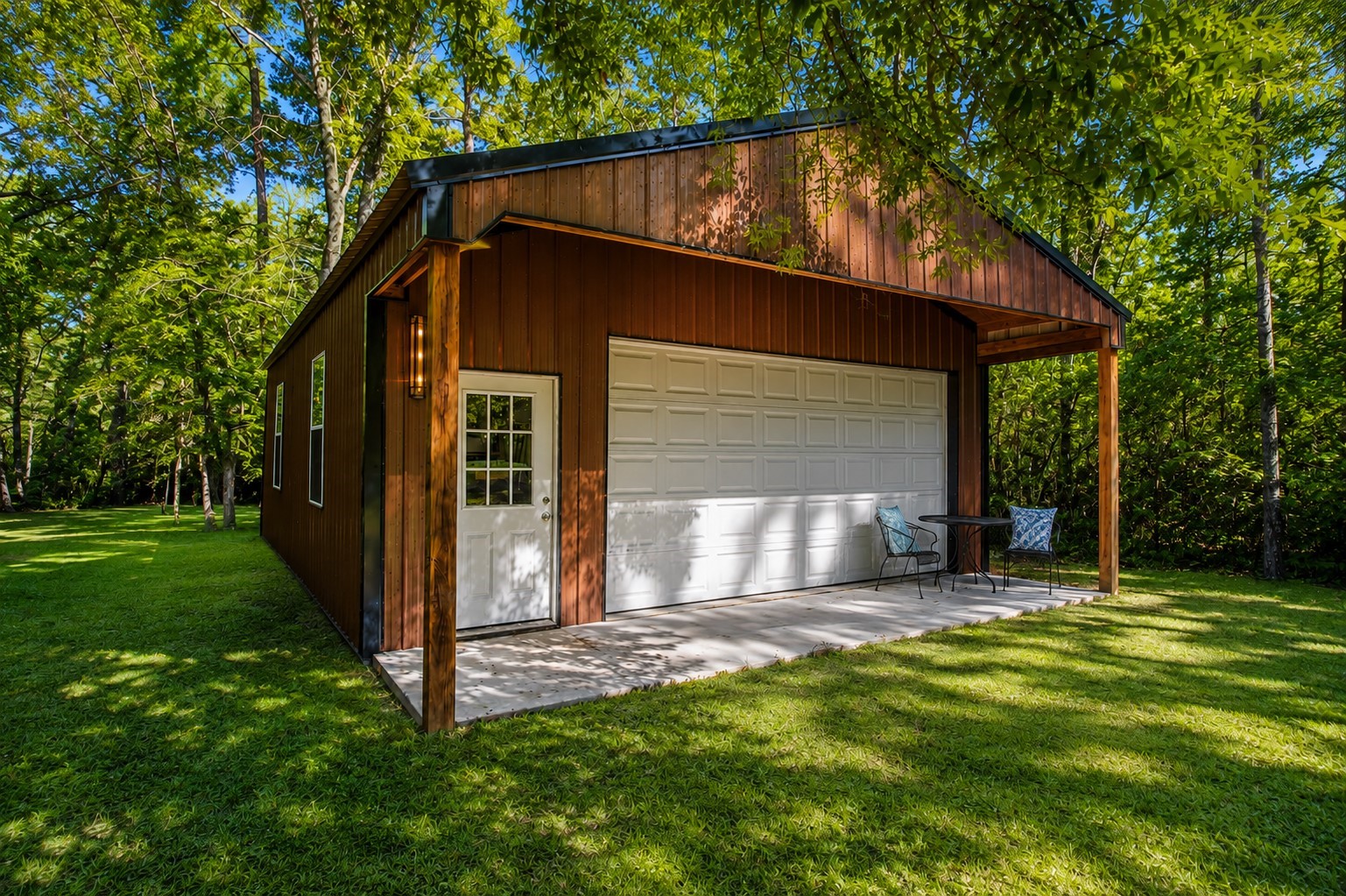 248 Fire Sky Road Huntsville, TX 77340 - Photo 32 of 36 A standout feature of the property—the substantial detached workshop offers a large garage door, covered porch and exceptional space for vehicles, equipment, hobbies or projects.