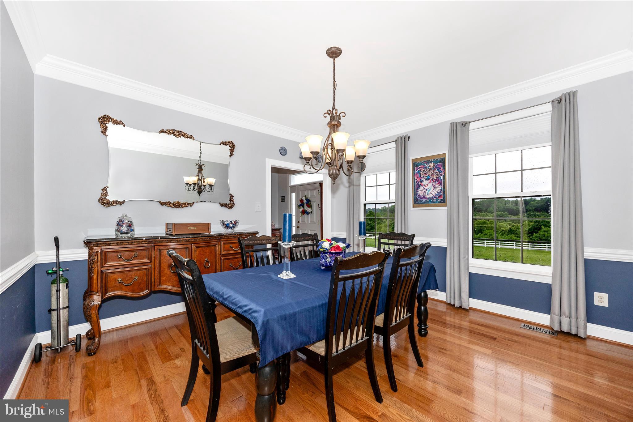 9855 McKinstry Mill Road New Windsor, MD 21776 - Photo 11 of 76 a view of a dining room with furniture and a chandelier