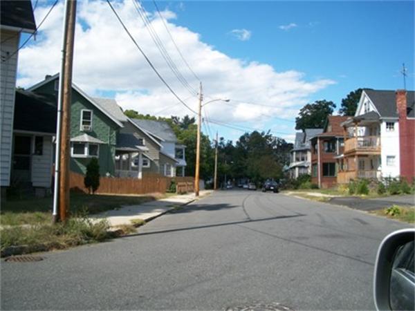 68 Lawndale Street Springfield, MA 01108 - Photo 3 of 7 a view of a street with brick building in the background