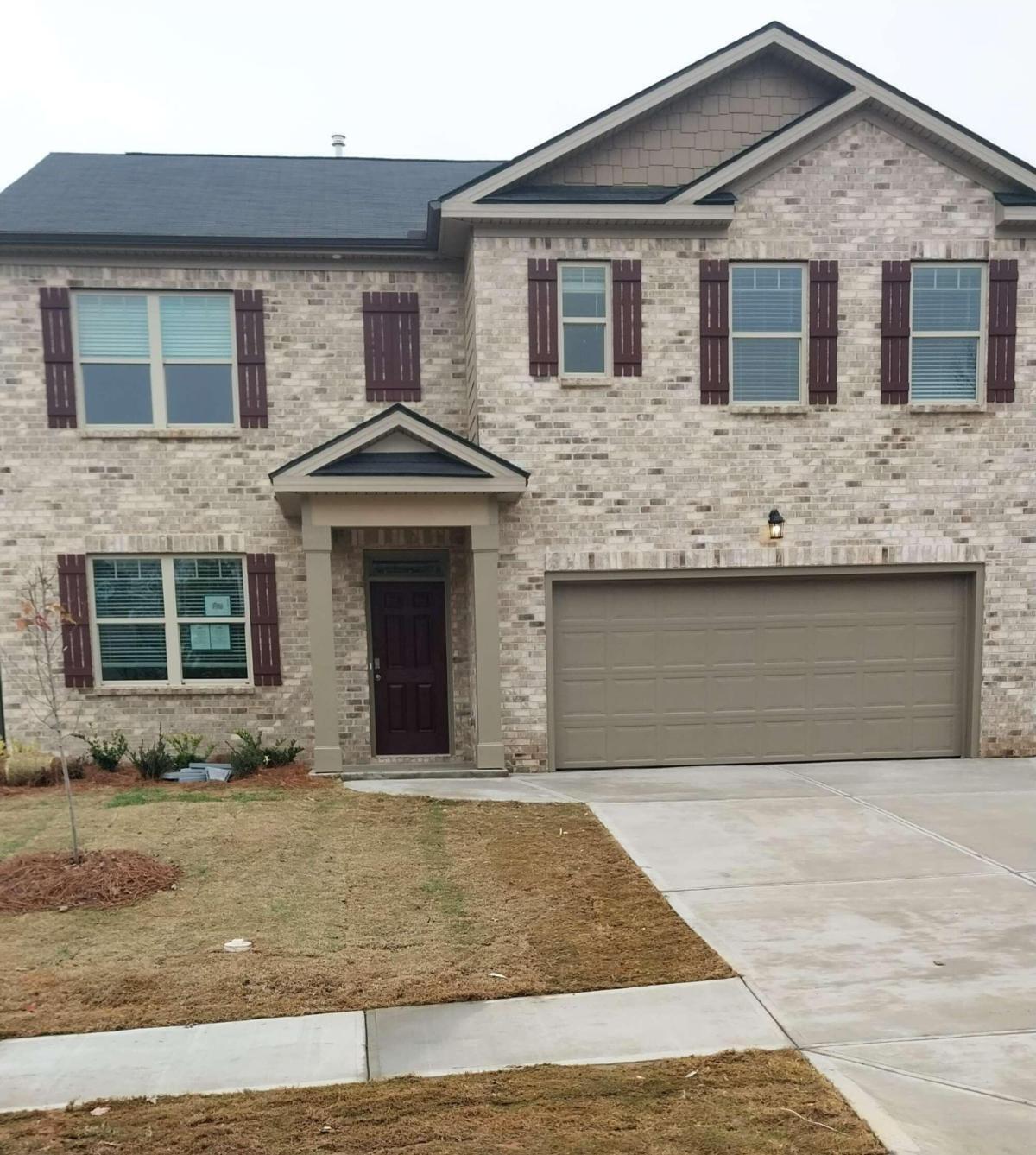4110 Flat Rock Point Lithonia, GA 30038 - Photo 1 of 1 a front view of a house with yard
