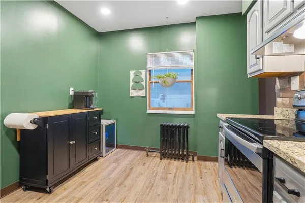 a kitchen with sink and cabinets