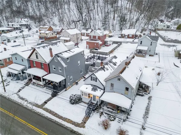 a view of a patio with table and chairs with wooden fence and plants