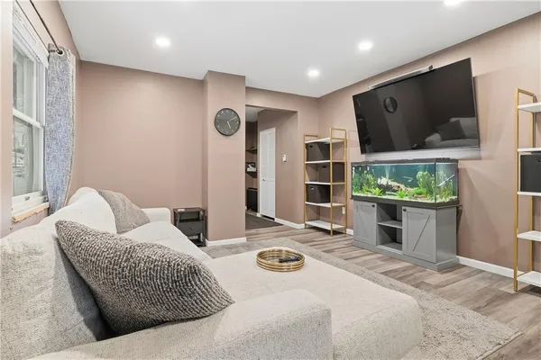 a bedroom with furniture and a flat screen tv