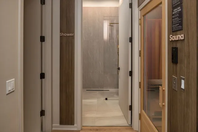 a bathroom with a glass shower door
