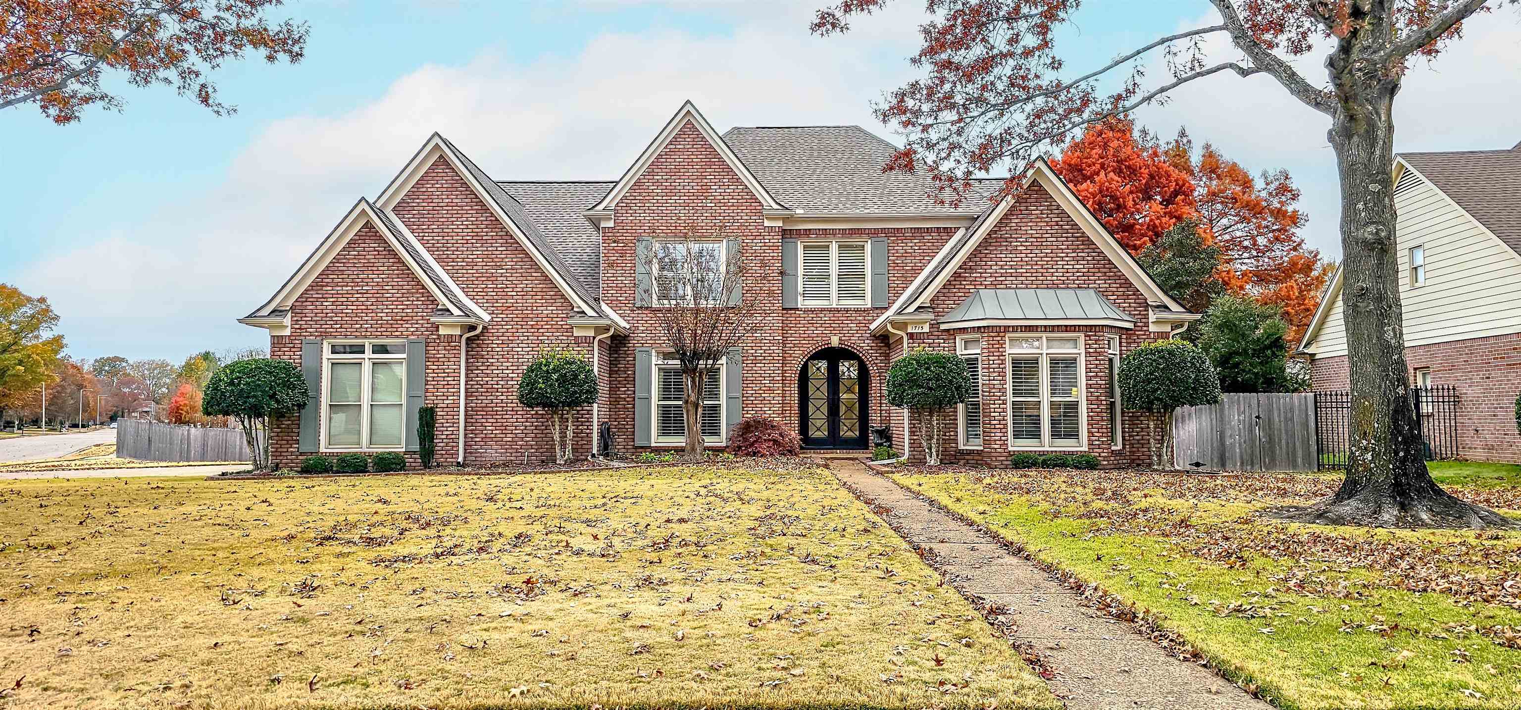 Stunning Curb Appeal with Lush Landscaping! Nestled on a Beautifully maintained corner lot with side load 3 car garage!