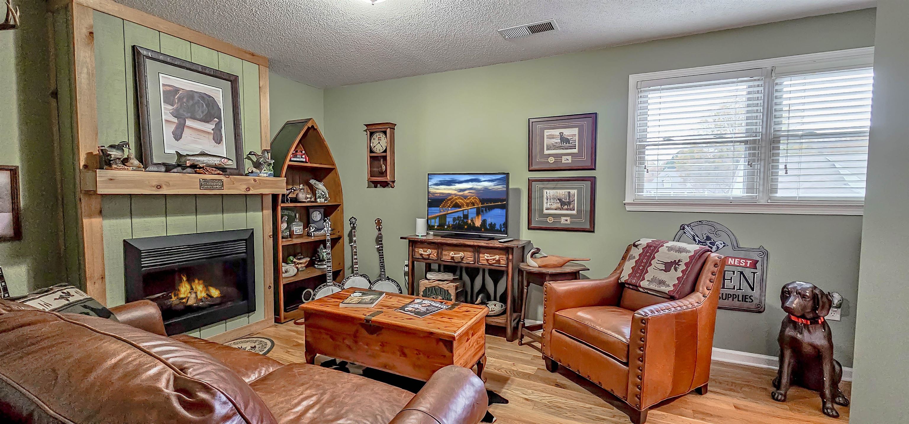 1715 John Ridge Drive Collierville, TN 38017 - Photo 31 of 37 Unique Cosy 4th Bedroom or Office upstairs enjoys a Electric Log Fireplace Wood Flooring & Big Closet!