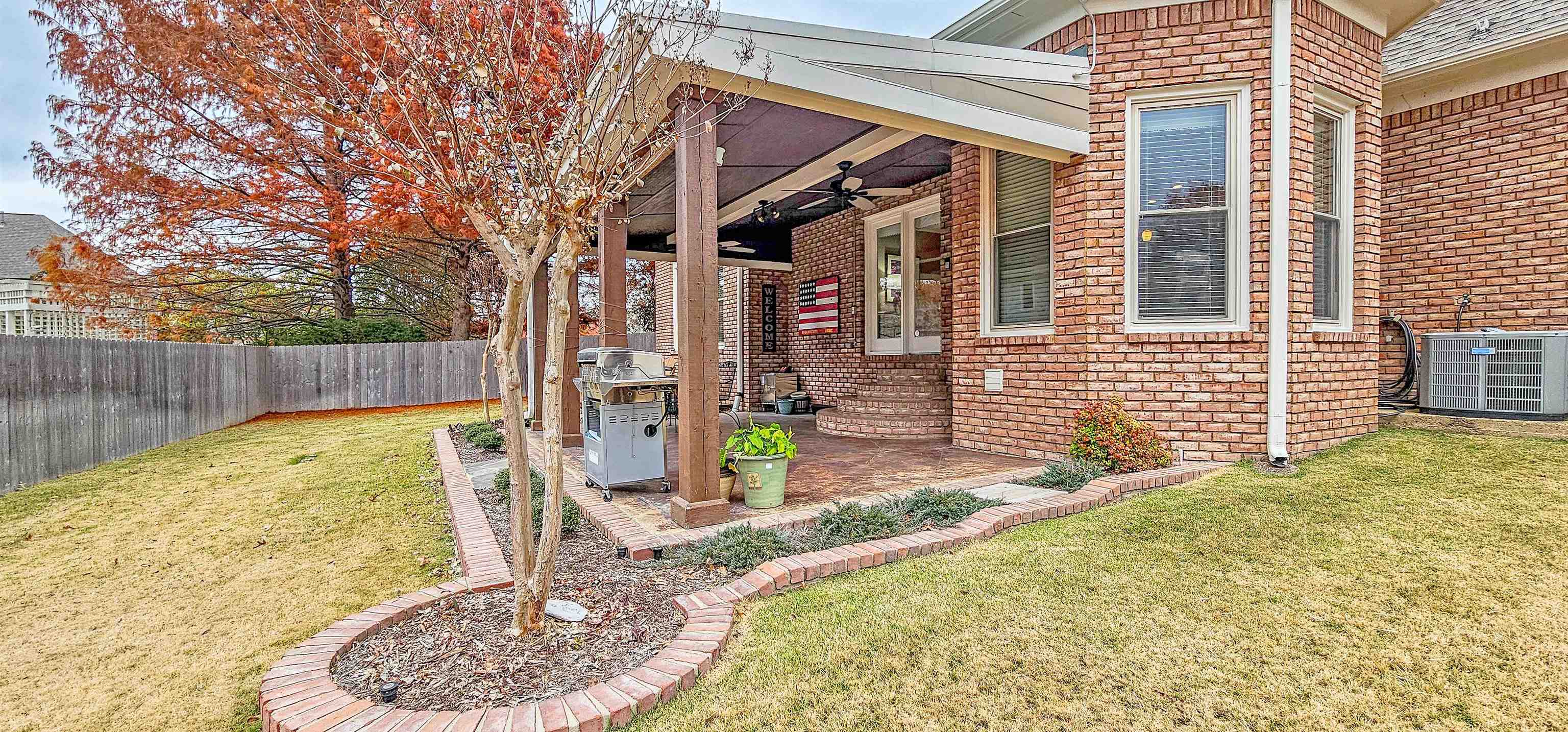 1715 John Ridge Drive Collierville, TN 38017 - Photo 34 of 37 Large Covered Patio is Perfect for Entertaining & Grilling! Metal Exterior Roof and Wood Ceiling & 2 Ceiling Fans!