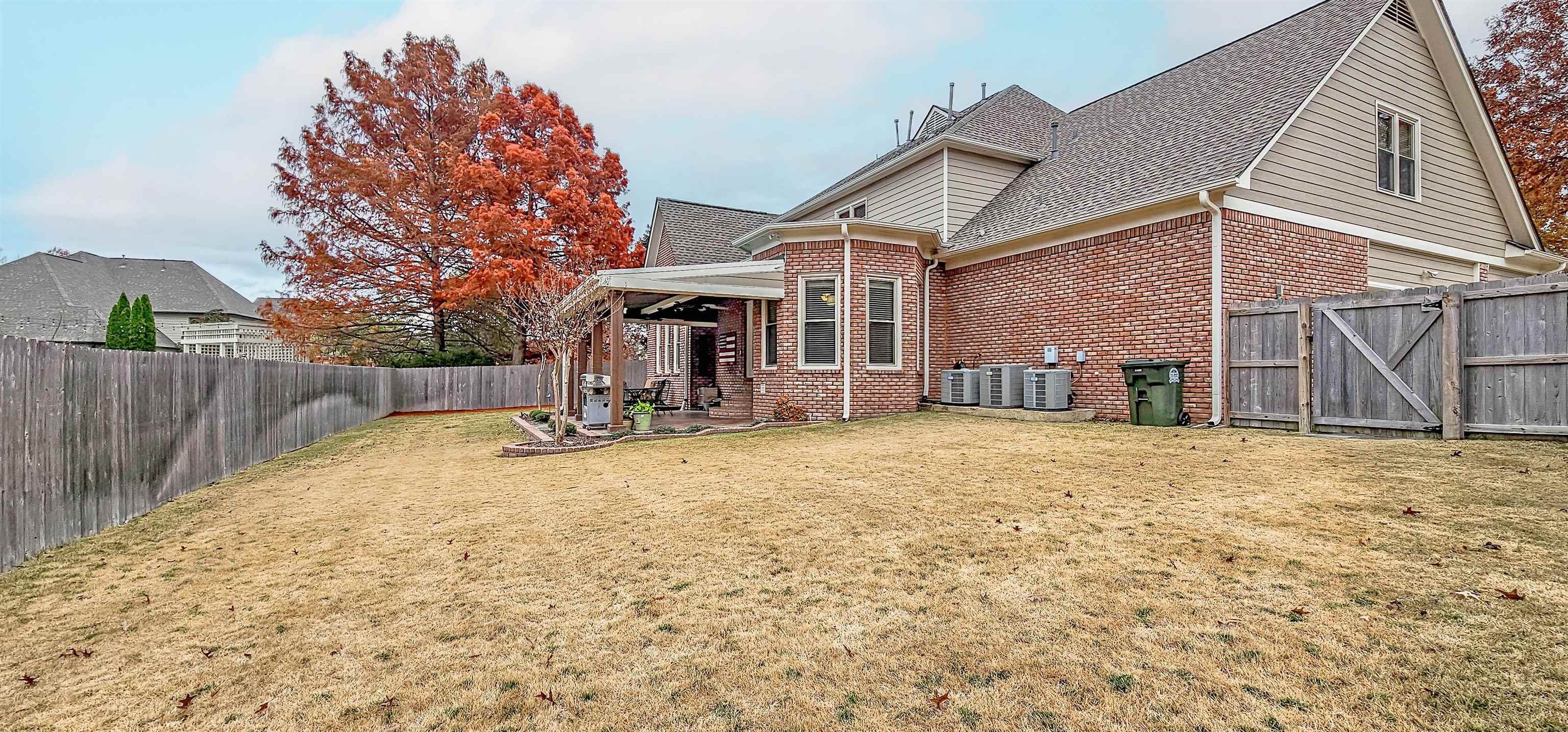 1715 John Ridge Drive Collierville, TN 38017 - Photo 37 of 37 Large Wood Gate to Access the Back Yard with Mowers or Wheelbarrow! Plenty of room for kids to play!