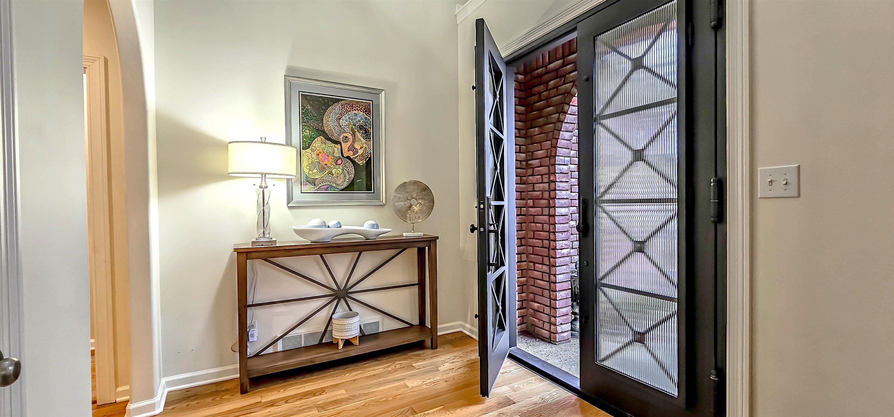 1715 John Ridge Drive Collierville, TN 38017 - Photo 4 of 37 Custom Iron Double Front Entry Doors with beaded glass greet your guests as they step inside the Foyer!