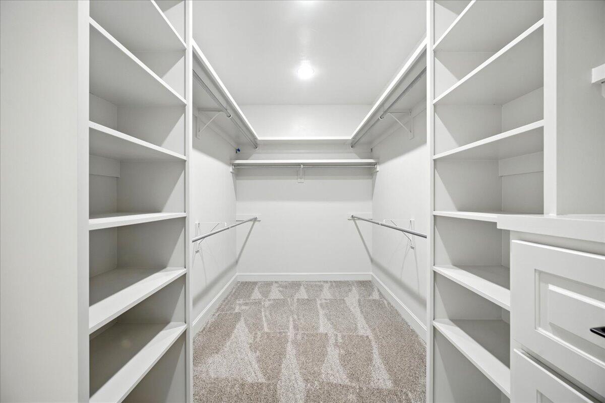 3615 143rd Street Lubbock, TX 79423 - Photo 19 of 32 a view of walk in closet with empty racks