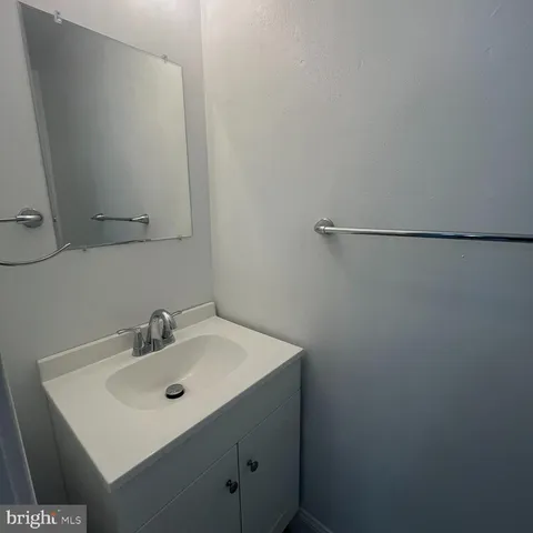 a bathroom with a sink and mirror