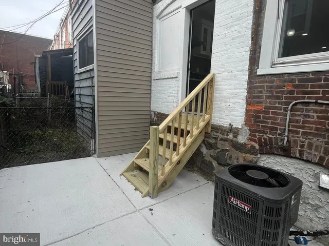 a terrace with outdoor seating and oven