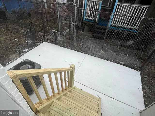 a view of balcony with wooden floor