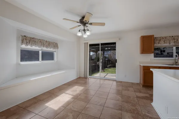 a view of a kitchen with a sink and a window