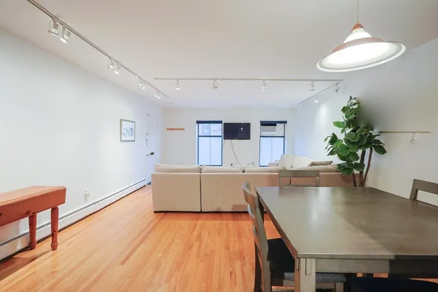 a kitchen with a table and chairs