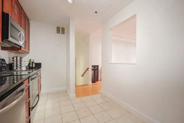 a view of a kitchen from the hallway