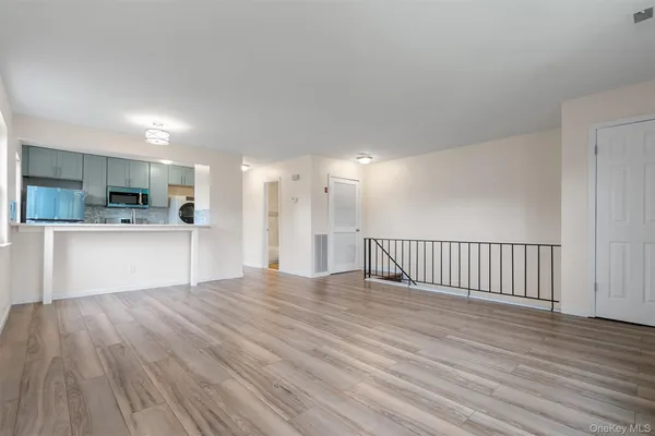 a view of a kitchen with a sink and a microwave