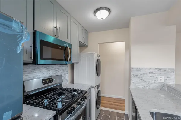 a kitchen with a stove and a microwave