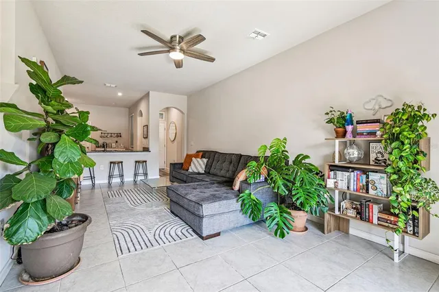 a backyard of a house with lots of green space and fountain