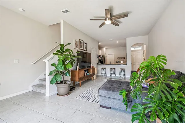 a view of a chair and table in backyard of the house
