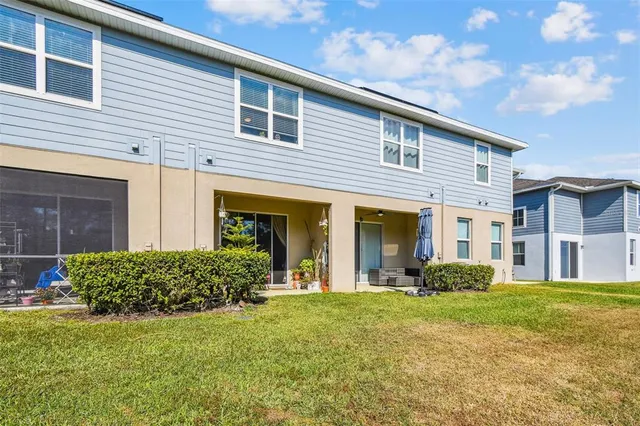 a bathroom with double vanity sinks a toilet a mirror and shower