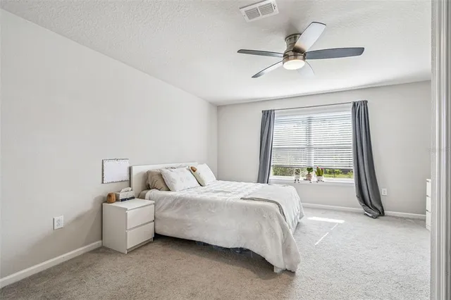 a view of a hallway with white walls
