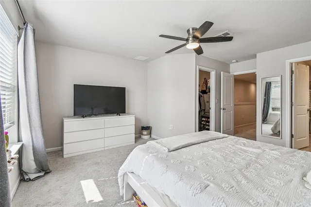 a en suite bathroom with a sink a mirror and a shower