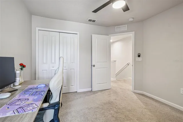 a view of a house with a swimming pool and a yard