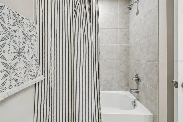 an aerial view of multiple houses with a yard